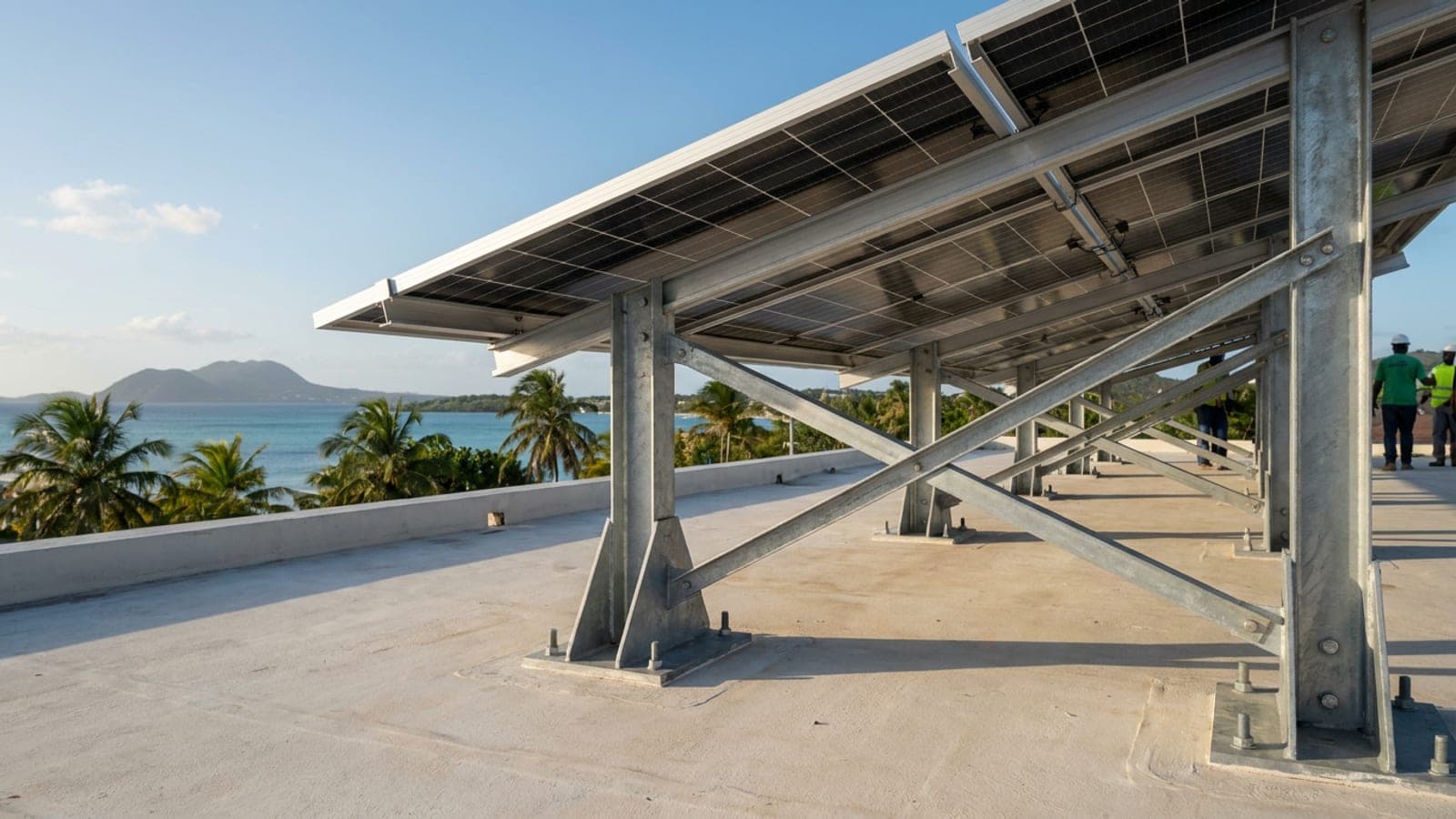 Heavy galvanized brackets and cross-bracing under a solar array built for hurricane wind loads