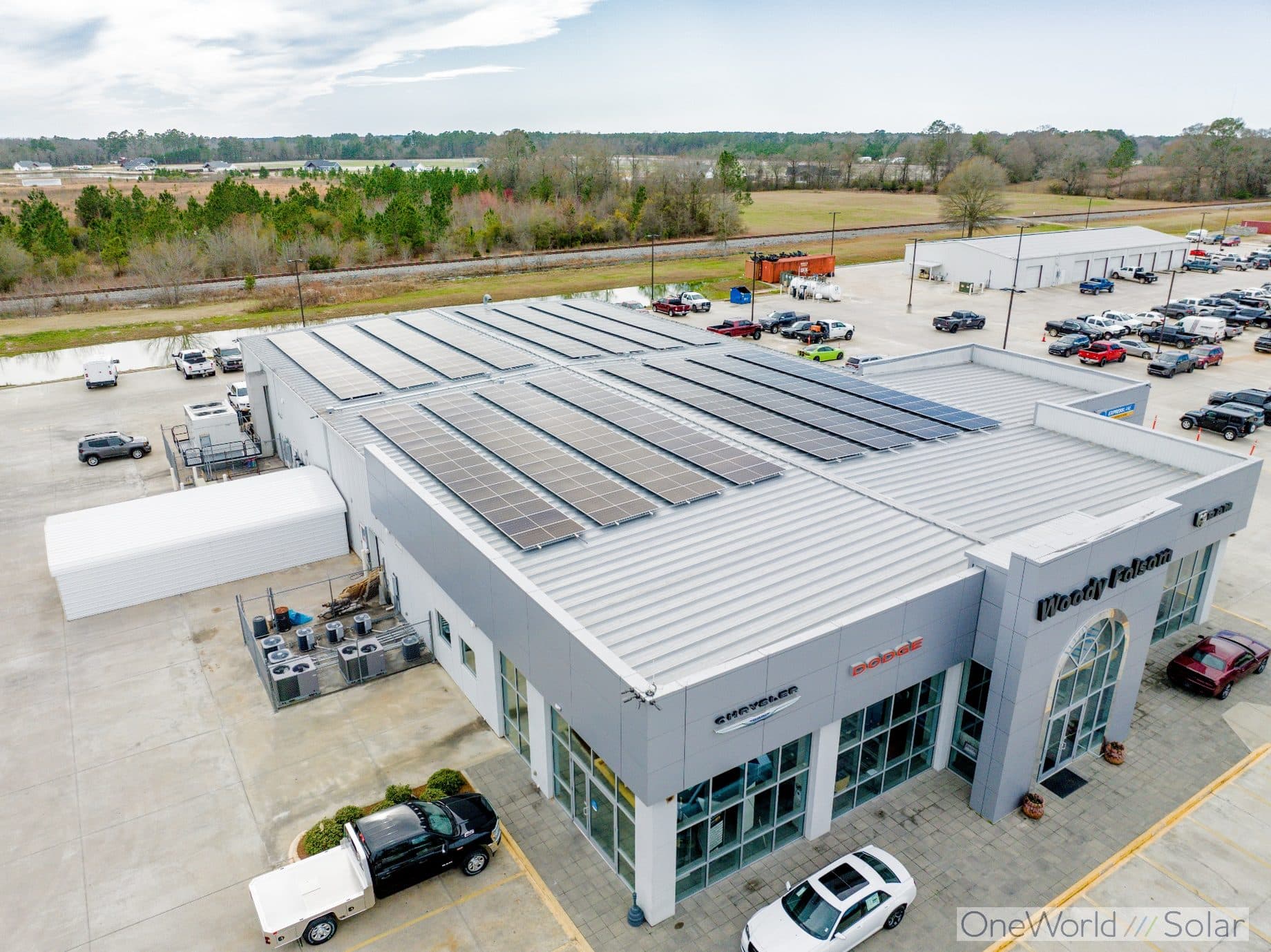 Aerial view of the solar array OneWorld Solar installed on the roof of the Woody Folsom Chrysler Dodge dealership in Georgia